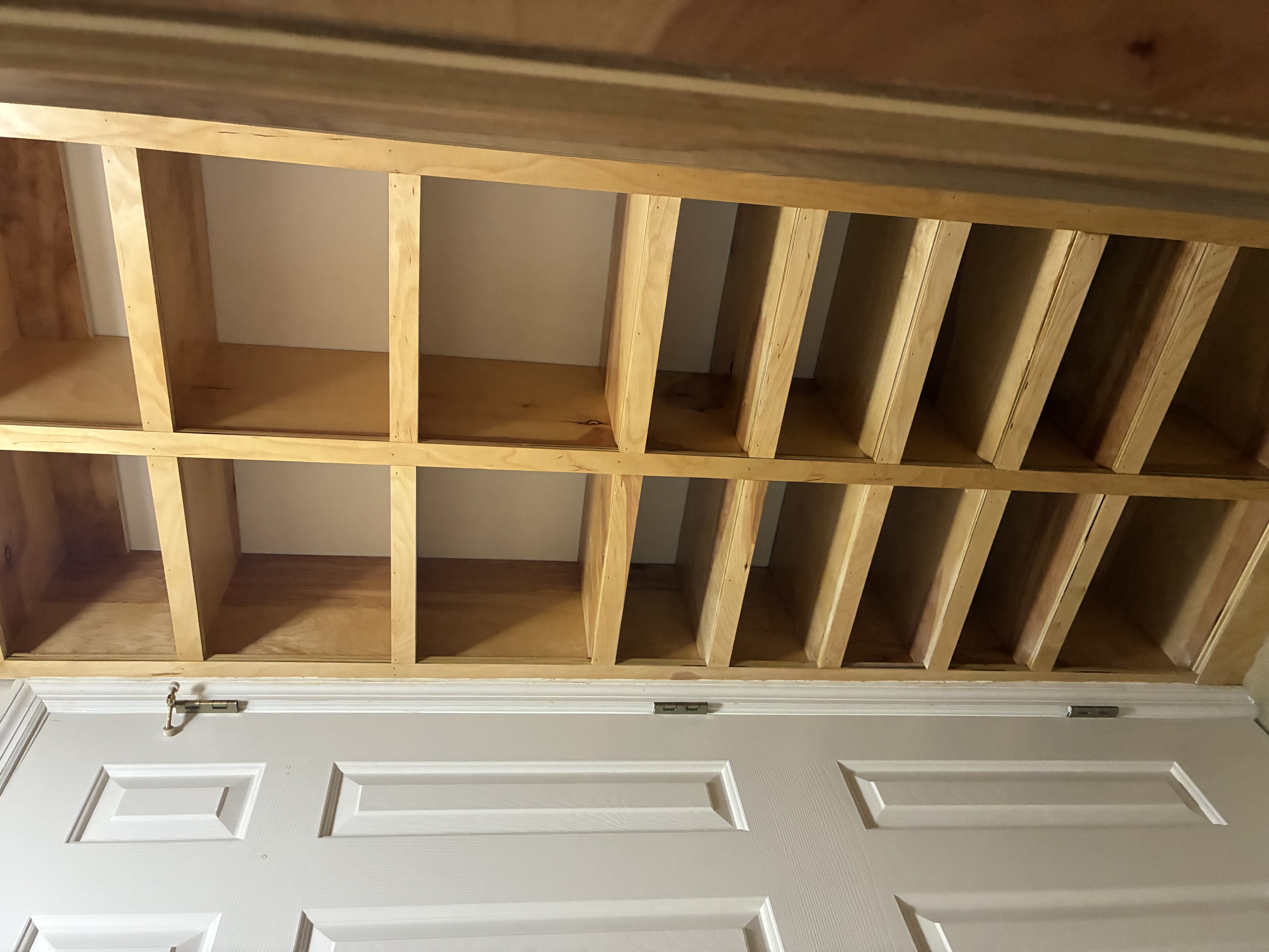 Closet two after, floor-to-ceiling shelf wall